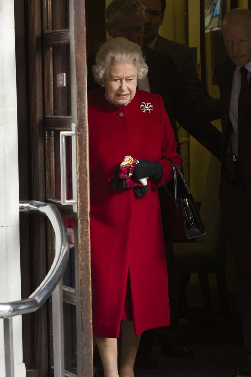  Queen Elizabeth II, wearing a red coat, leaves hospital on March 4, 2013 in London, England. Getty Images