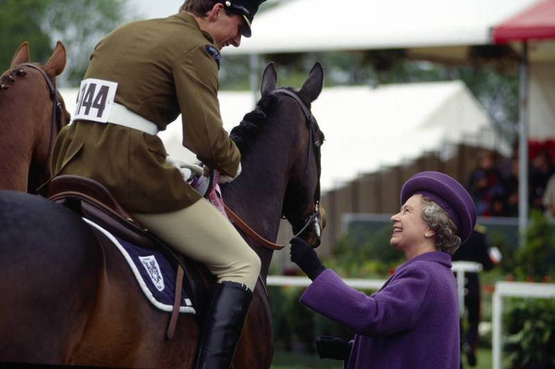 Queen Elizabeth II presents prizes at the Royal Windsor Horse Show on the grounds of Windsor Castle, on May 11, 1991. Getty Images