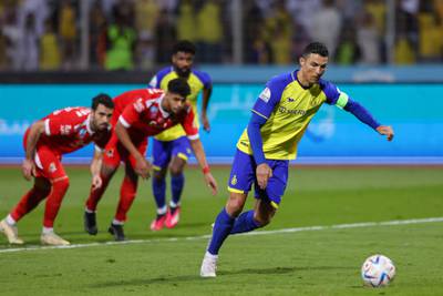Al Nassr's Portuguese forward Cristiano Ronaldo scores from the penalty spot for his and Nassr's third goal. AFP