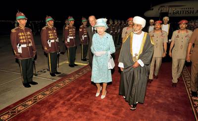 MUSCAT, OMAN - NOVEMBER 25: Queen Elizabeth II walks with the Sultan of Oman, His Majesty Qaboos bin Said Al Said, after arriving from the UAE on November 25, 2010 in Muscat, Oman.  Queen Elizabeth II and Prince Philip, Duke of Edinburgh are in Oman on a State Visit to the Middle East. The Royal couple spent two days in Abu Dhabi and will stay three days in Oman. (Photo by John Stillwell-Pool/Getty Images)