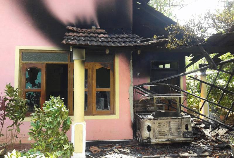 One of the houses burnt during racial violence near Galle on Saturday that started after a traffic accident the day before