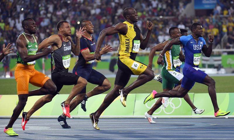Usain Bolt (C) competes in the men’s 100m Final during the Rio 2016 Olympic Games at the Olympic Stadium in Rio de Janeiro on August 14, 2016. Damien Meyer / AFP