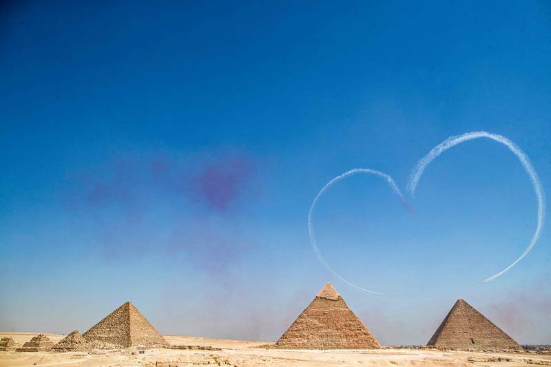 A heart-shaped jet trail above the Giza Pyramids Necropolis. AFP