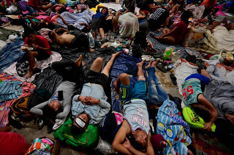 Migrants rest in Huixtla. AFP