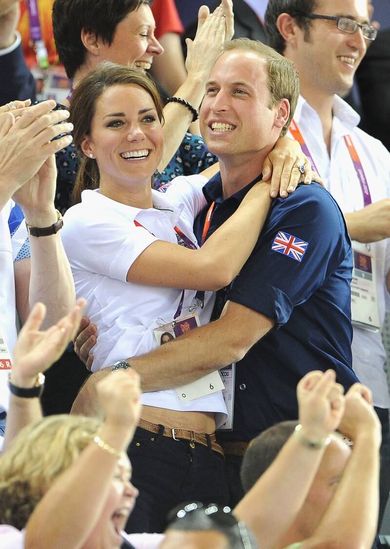 Catherine and Prince William celebrate after watching cyclists Philip Hindes, Jason Kenny and Sir Chris Hoy of Great Britain win the gold and set a world record during the London 2012 Olympic Games. 