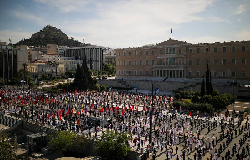 Members of the communist-affiliated trade union PAME practice social distancing during a rally commemorating May Day in Athens, Greece. Reuters