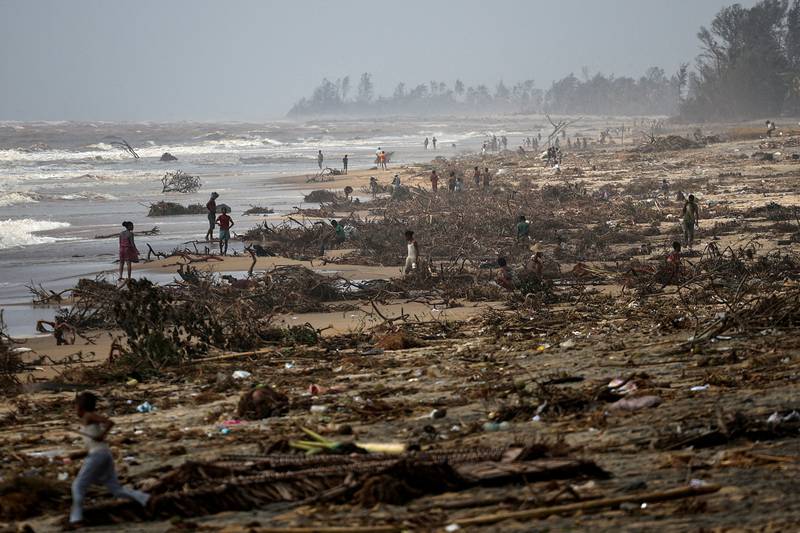 Searching for valuables on the beach after Cyclone Batsirai hit Madagascar on February 8.  Reuters
