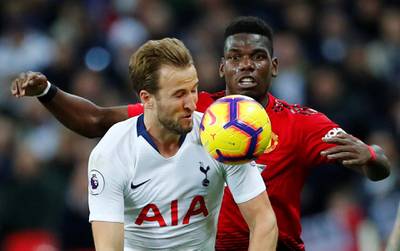 Kane in action with Manchester United's Paul Pogba. Reuters