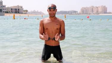 An image that illustrates this article Dubai coach smashes swimming in handcuffs world record  