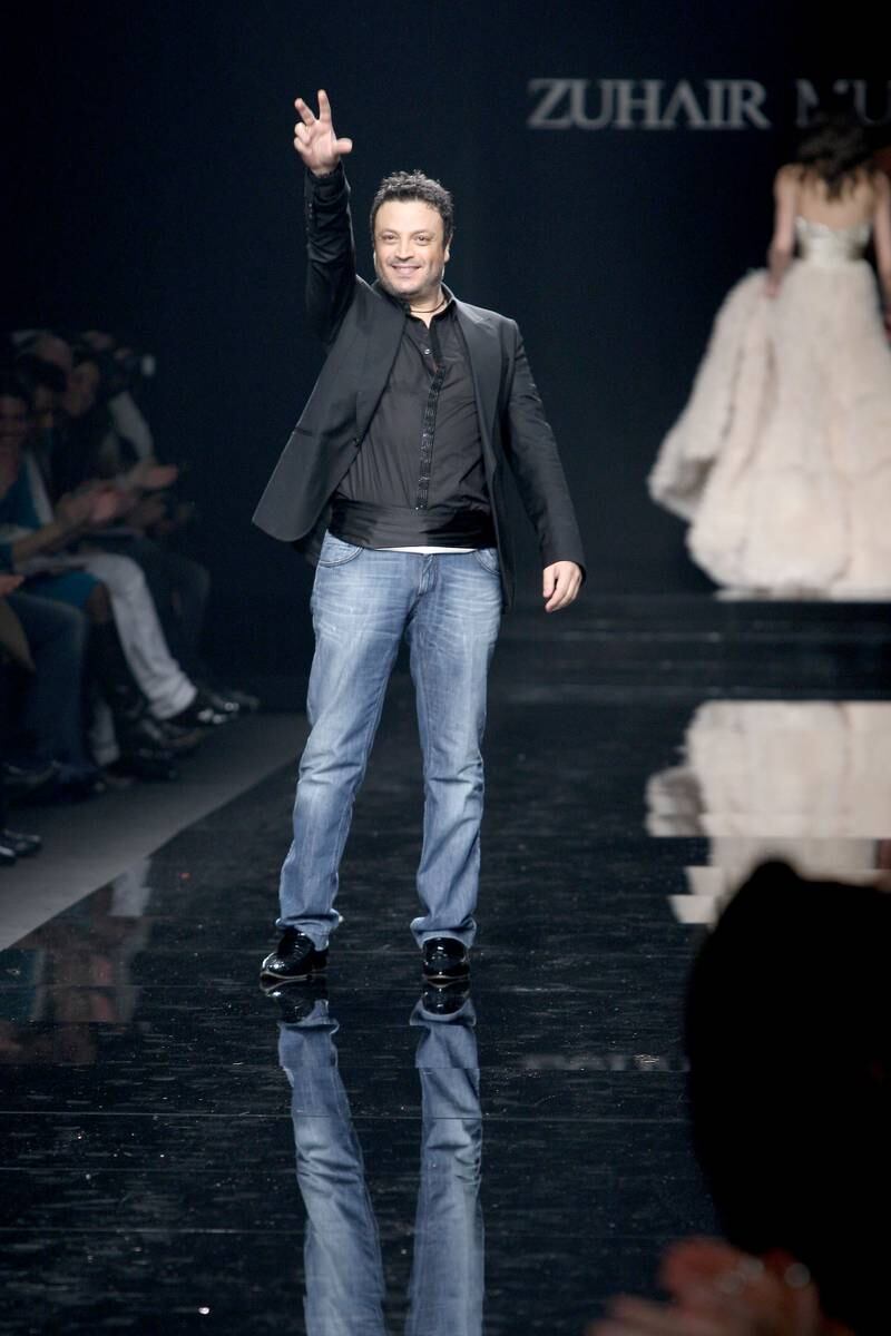 Designer Zuhair Murad acknowledges the applause after his womenswear autumn/winter 2009 fashion show during Milan Fashion Week, on March 3, 2009, in Italy. Getty