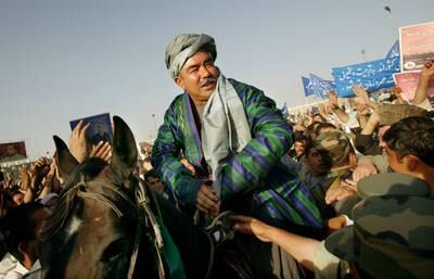 General Abdul Rashid Dostum sits on a horse during his final campaign rally at Kabul stadium in Kabul, Afghanistan, October 6, 2004. Getty Images