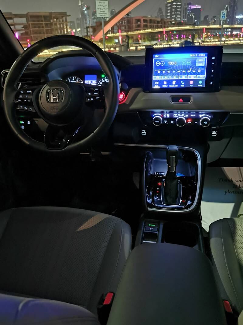 The centre console features an eight-inch colour touchscreen display with Apply CarPlay and Android Auto.