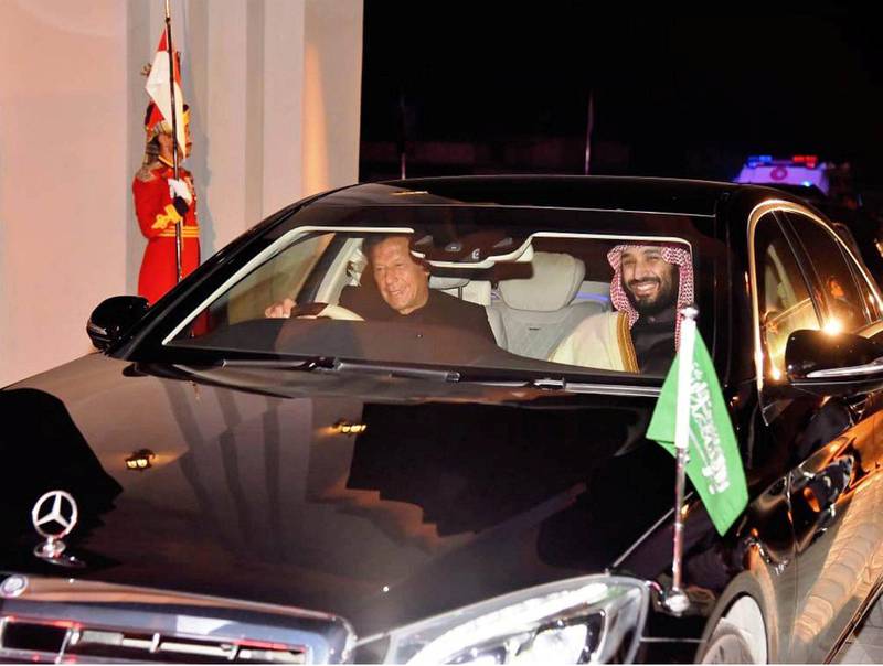 Imran Khan drives Mohammed bin Salman to their engagement. Pakistan is the Saudi crown prince's first stop on an Asian tour Reuters