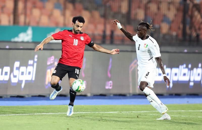 Egypt's Mohamed Salah, left, in action against Guinea's Issiaga Sylla. EPA
