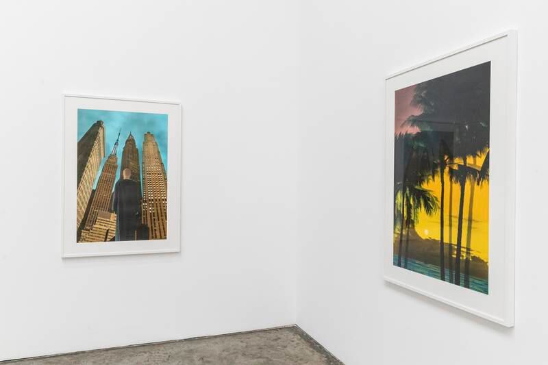The works in the exhibition range from beach views with silhouetted flying birds against a blazing sky to self-portraits of Nabil facing a mountainous terrain, an urban landscape or a star studded sky. Antonie Robertson / The National
