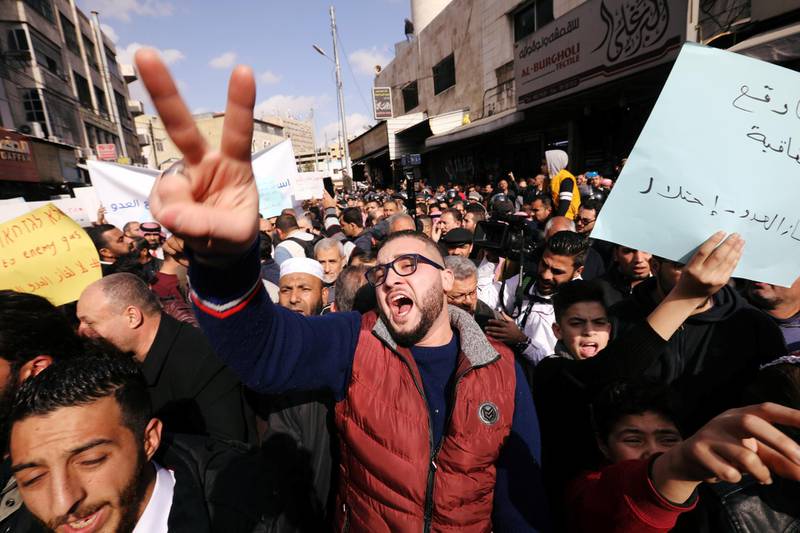 Demonstrators chant slogans during a protest against a government's agreement to import natural gas from Israel, in Amman, Jordan. The placard reads: "The enemy's gas is occupation". Reuters