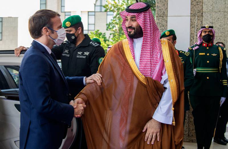 Saudi Arabia's Crown Prince Mohammed bin Salman, right, receives French President Emmanuel Macron in Jeddah on Saturday. AFP