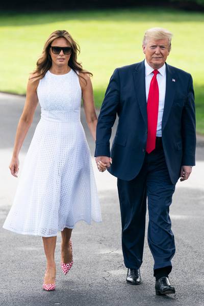epa07656702 US President Donald J. Trump (R), alongside First Lady Melania Trump (L), prepares to speak to the media as he departs the White House for a campaign event in Florida in Washington, DC, USA, 18 June 2019. President Trump is travelling to Orlando to launch his 2020 re-election campaign. Prior to leaving the White House, the President spoke about Patrick Shanahan, who withdrew from consideration to be Trump's permanent defense secretary. He also spoke about tariffs, immigration, and growing tensions with Iran.  EPA-EFE/JIM LO SCALZO