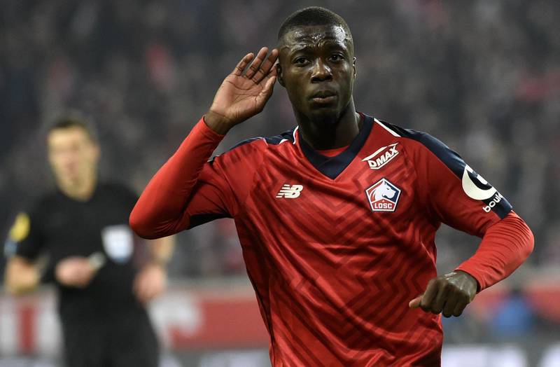 (FILES) In this file photo taken on December 01, 2018 Lille's Ivorian forward Nicolas Pepe celebrates after scoring a goal during the French L1 football match between Lille (LOSC) and Olympique Lyonnais (OL) at the Pierre Mauroy Stadium in Villenueve d'Ascq. Arsenal announced the signing of winger Nicolas Pepe from French side Lille on August 1, 2019 for a club-record fee reported to be 80 million euros (£72 million). / AFP / FRANCOIS LO PRESTI
