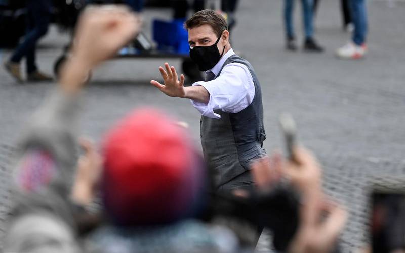 Tom Cruise greets fans during the shooting of 'Mission: Impossible 7' at Piazza Venezia in Rome, Italy on November 29, 2020. EPA