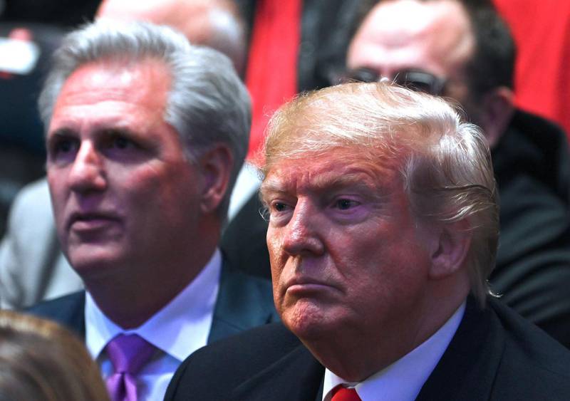 US President Donald Trump, flanked by House Minority Leader Kevin McCarthy, watches UFC 244 at Madison Square Garden in New York City. AFP