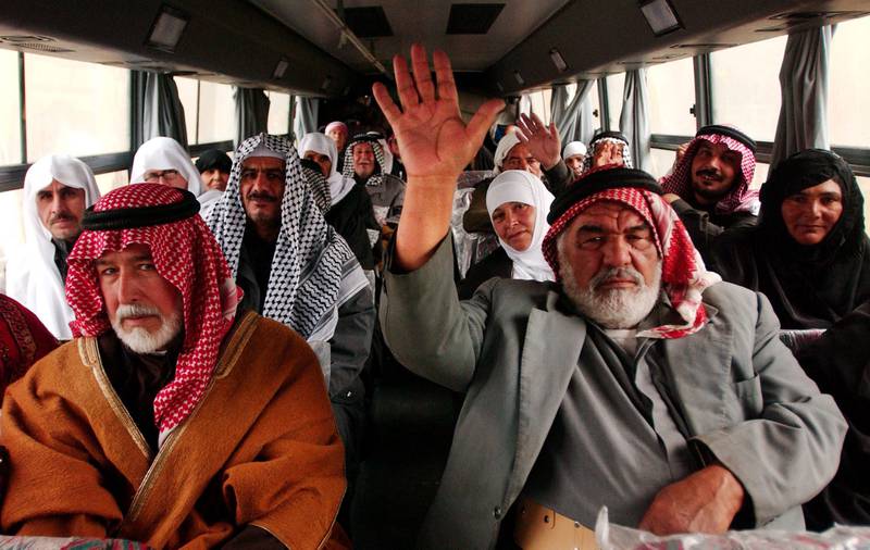 Iraqis travel to Makkah by bus in 2004, after the ousting of Saddam Hussein led to the removal of restrictions on who could make the pilgrimage.