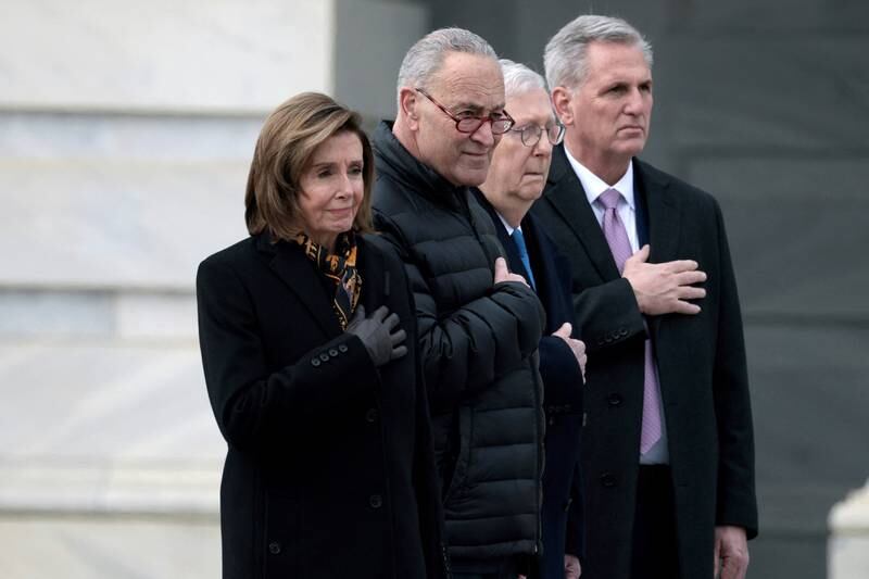 US Speaker of the House Nancy Pelosi, Majority Leader Charles Schumer, Minority Leader Mitch McConnell and House Minority Leader Kevin McCarthy watch as the casket is carried down the steps of the US Capitol. Reuters