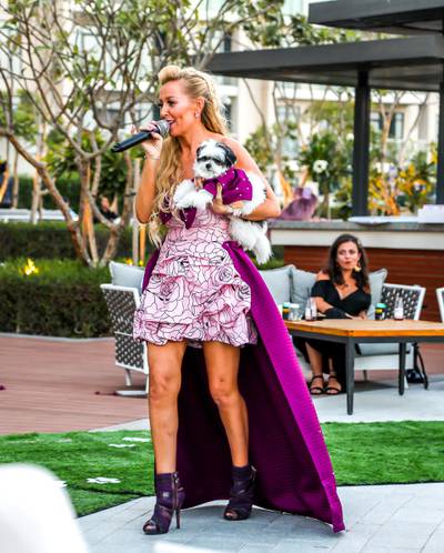 Boujie Paws Co's Dawn Appel with her pet Hepburn, wearing co-ordinated purple looks. Courtesy Boujie Paws Co