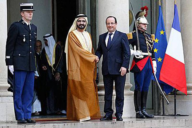 Sheikh Mohammed bin Rashid, Vice President and Ruler of Dubai, shakes hands with the French president Francois Hollande at the Elysee Palace in Paris yesterday. Sheikh Mohammed’s visit follows his appearance at the presentation of Dubai’s bid for Expo 2020 on Wednesday. Yoan Valat / EPA