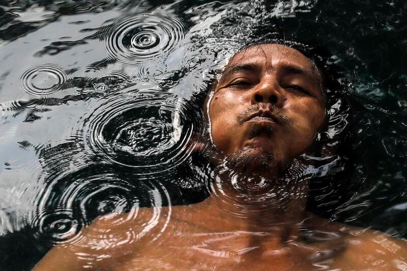 A man holds his breath while he swims in a hot spring near Kuala Lumpur, Malaysia. World Water Day, marked annually on March 22, raises awareness of the 2.2 billion people living without access to safe water. EPA