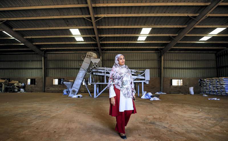 Sarah al-Fateh, General Manager at Teital Oil Mills, walks at the facility in the Sudanese capital Khartoum on November 24, 2019. - A year after the start of a protest movement that led to the fall of dictator Omar al-Bashir, Sudan is looking for a fresh start despite a stagnant economy. The United States in 1997 imposed a trade embargo on Sudan for hosting Al-Qaeda leader Osama bin Laden between 1992 and 1996, affecting not only international banking but also technology and trade in spare parts. While the embargo was lifted in 2017, business owners are still unable to invest in their facilities as the country is not part of the global banking system and they are unable to make international money transfers. (Photo by Ashraf SHAZLY / AFP)