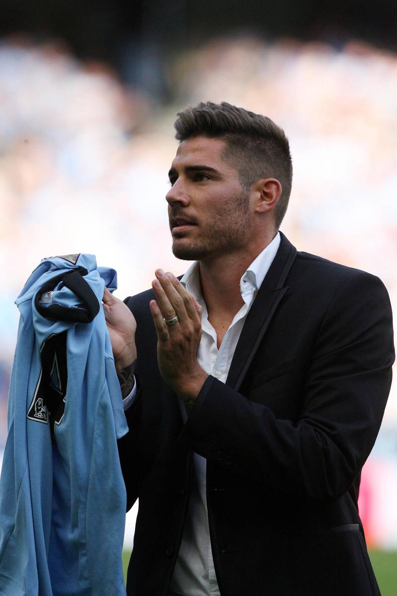 epa03379033 Manchester City new signing Javi Garcia is presented to supporters prior to the English Premier League soccer match between Manchester City and QPR at the Etihad Stadium in Manchester, Britain, 01 September 2012. Javi Garcia on 31 August signed for City from Portuguese club Benfica.  EPA/LINDSEY PARNABY DataCo terms and conditions apply http//www.epa.eu/downloads/DataCo-TCs.pdf *** Local Caption ***  03379033.jpg