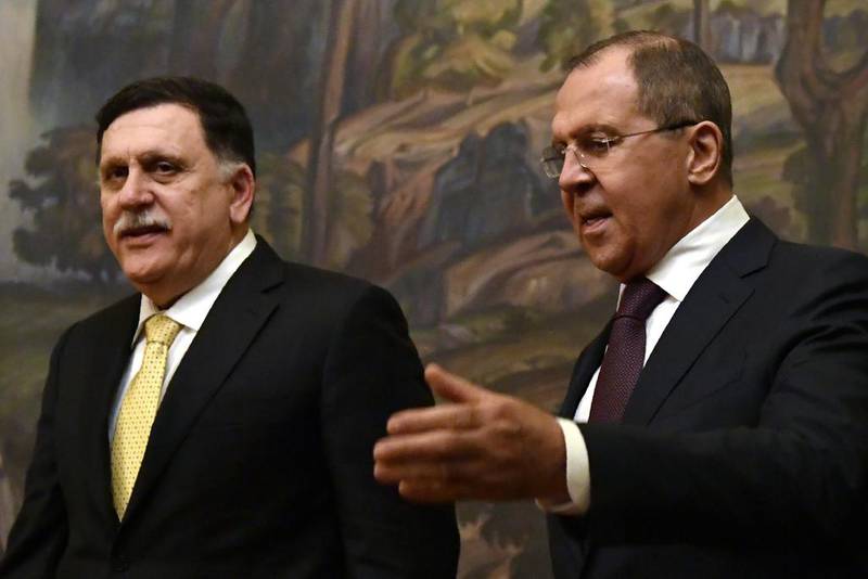Russian foreign minister Sergey Lavrov (R) shows the way to Fayez Al Sarraj, head of the UN-backed Libyan government, during their meeting in Moscow on March 2, 2017. Yuri Kadobnov / AFP Photo