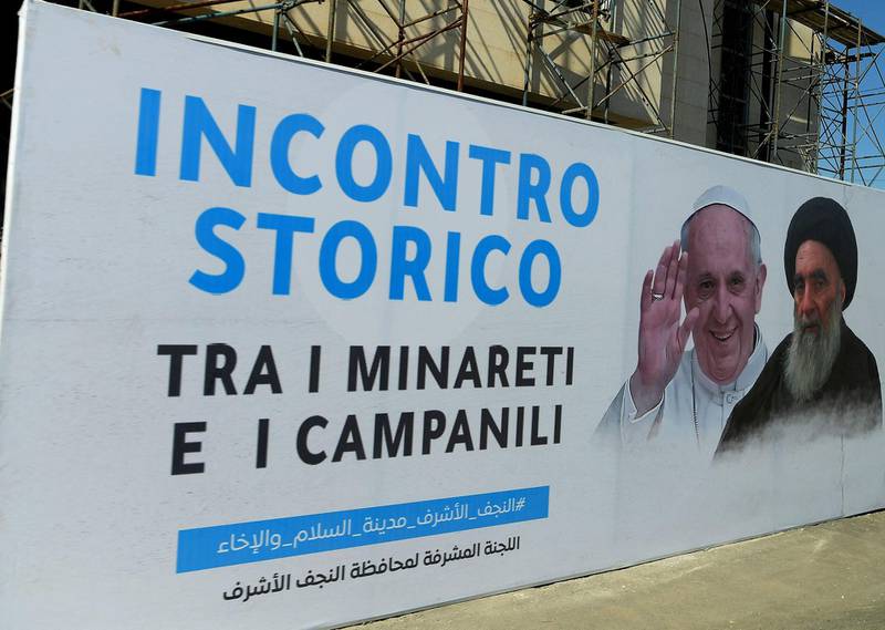 A handout picture released by the Vatican media shows a billboard marking the historic meeting between Pope Francis and top Shiite cleric Grand Ayatollah Ali al-Sistani, in the Iraqi shrine city of Najaf, on March 6, 2021. The slogan in Italian reads "The Historic Meeting Between Minarets and Bells". Grand Ayatollah Ali Sistani, spiritual leader of most of the world's Shiite Muslims, told Pope Francis in their meeting that the country's Christians should live in "peace." - === RESTRICTED TO EDITORIAL USE - MANDATORY CREDIT "AFP PHOTO / HO / VATICAN MEDIA" - NO MARKETING NO ADVERTISING CAMPAIGNS - DISTRIBUTED AS A SERVICE TO CLIENTS ===
 / AFP / VATICAN MEDIA / - / === RESTRICTED TO EDITORIAL USE - MANDATORY CREDIT "AFP PHOTO / HO / VATICAN MEDIA" - NO MARKETING NO ADVERTISING CAMPAIGNS - DISTRIBUTED AS A SERVICE TO CLIENTS ===
