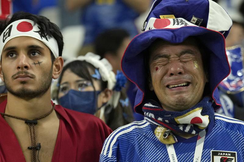 Fans of Japan show their emotions after their defeat to Croatia. AP Photo