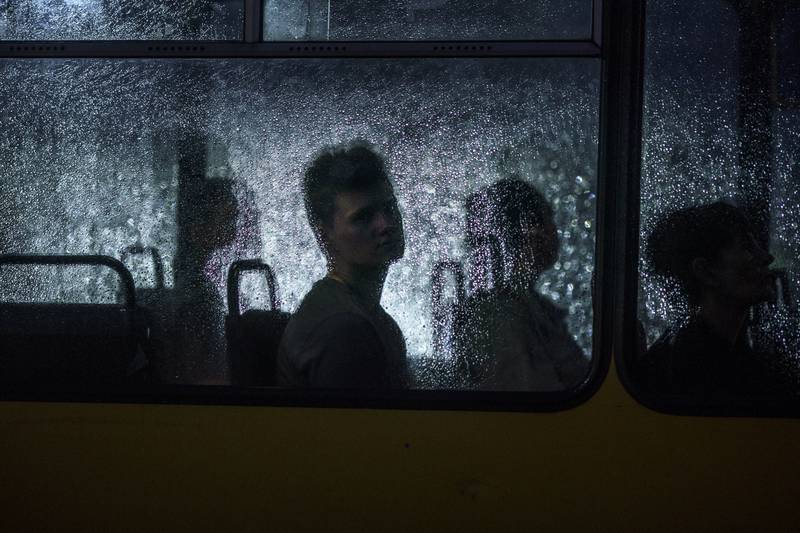A passenger on a city bus during a rain shower in Dnipro, Ukraine. AP