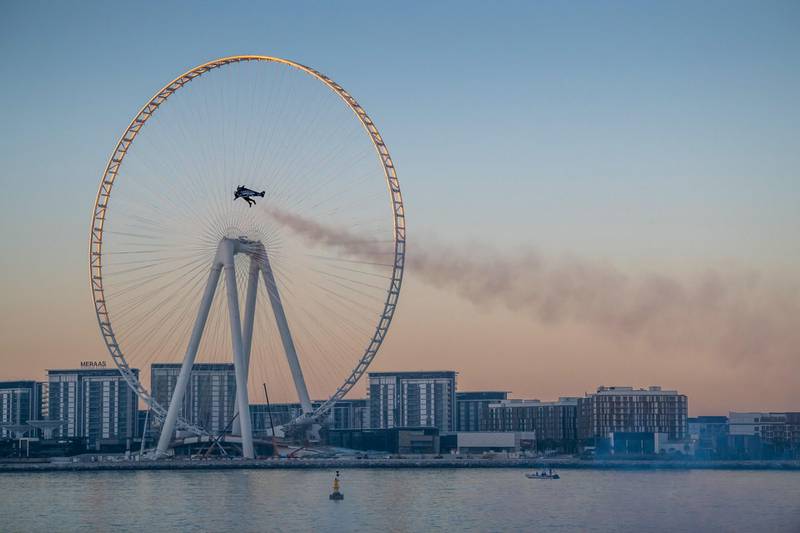 Vince Reffet, known as Jetman, takes part in a flight near the Ain Dubai (Dubai Eye) Ferris Wheel in February 2020. AFP / Expo 2020