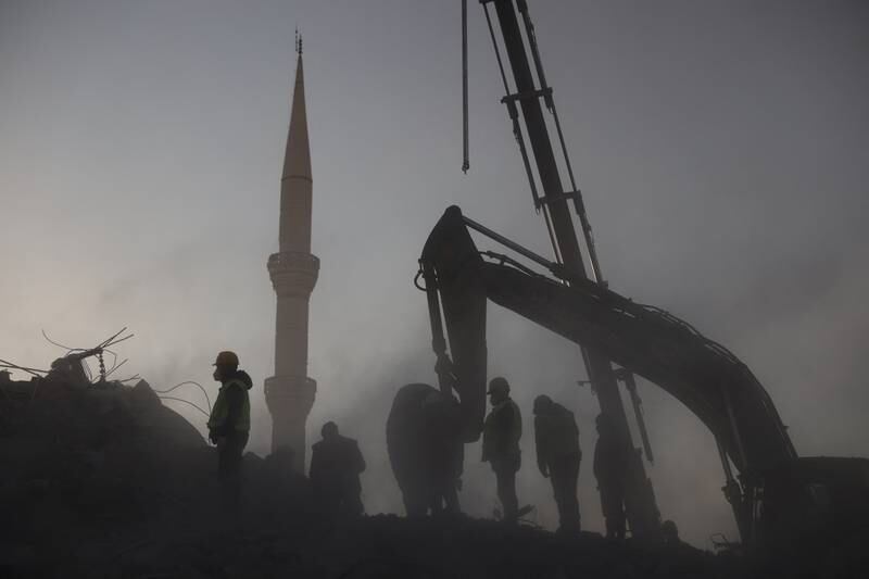 Rescuers search for survivors under the rubble of a collapsed building in Kahramanmaras. Reuters