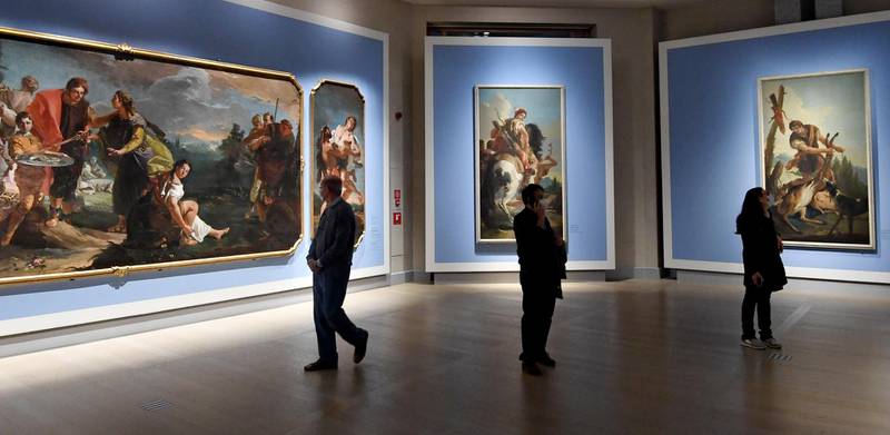 People visit the exhibition 'Tiepolo, Venice, Milan, Europe' at the Gallerie d'Italia in Milan, as coronavirus-related restrictions in most parts of Italy are eased from April 26, 2021. EPA