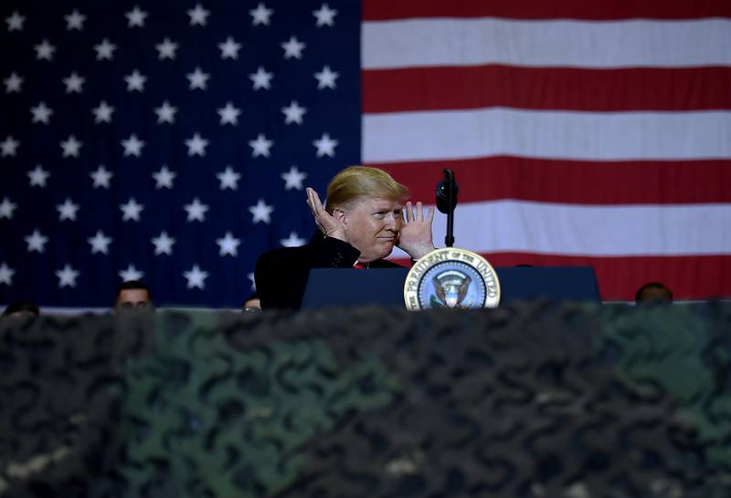 On a brief visit to Bagram Airfield outside the capital Kabul, Mr Trump served turkey dinner to soldiers, posed for photographs and delivered a speech. AFP