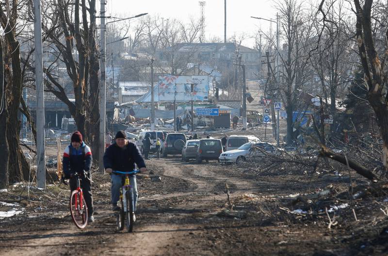 Cyclists in the city of Volnovakha in the Donetsk region, after Russian-backed separatists wrestled control of it from Ukrainian troops.  Reuters