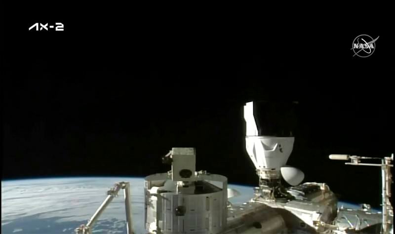 The Sun rises over the ISS after the SpaceX capsule docks. AP