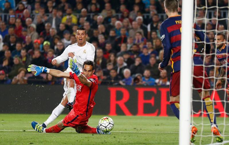 Cristiano Ronaldo scores his side’s second goal past Barcelona goalkeeper Claudio Bravo on April 2, 2016. Manu Fernandez / AP