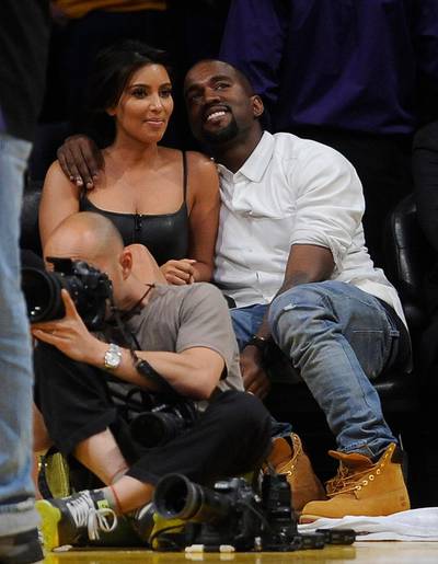 epa03216826 US celebutante Kim Kardashian (L) and US singer Kanye West (R) attend the Denver Nuggets against Los Angeles Lakers game seven of the Western Conference quarterfinals at the Staples Center in Los Angeles, California, USA, 12 May 2012.  EPA/MICHAEL NELSON CORBIS OUT