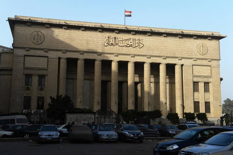 A picture shows Egypt’s High Court in downtown Cairo on January 1, 2015, during the hearing of three Al-Jazeera reporters on charges of aiding the Muslim Brotherhood. Egypt's top court ordered a retrial of the three Al-Jazeera reporters whose imprisonment on charges of aiding the Muslim Brotherhood triggered global outrage, but kept them in custody pending a new hearing. Australian Peter Greste, Egyptian-Canadian Mohamed Fahmy and Egyptian Baher Mohamed of the broadcaster's English service were detained in December 2013. AFP PHOTO / KHALED DESOUKI (Photo by KHALED DESOUKI / AFP)