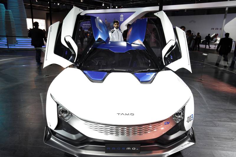epa06502795 A model poses with Indian automobile manufacturer, Tata Motors Limited's Tamo Racemo+ EV (Electric Vehicle) sportscar during the India Auto Expo 2018 in Greater Noida, India, 07 February 2018. Over 20 leading original equipment manufacturers (OEMs) are showcasing more than a hundred products during the India Auto Expo 2018, which will open to the public from 09 February to 14 February.  EPA-EFE/RAMINDER PAL SINGH