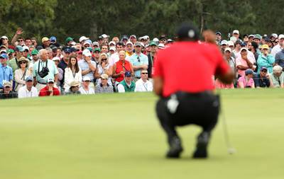 Tiger Woods prepares to putt on the 17th green during final round play. Jonathan Ernst / Reuters