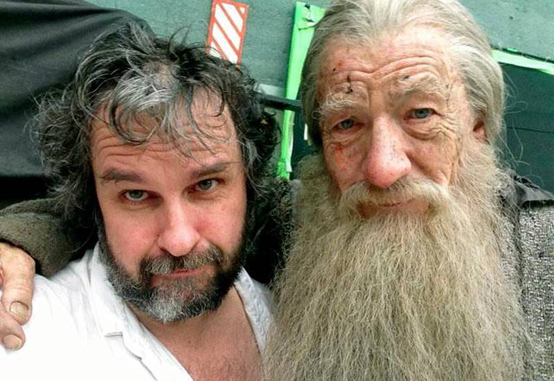 This Friday, July 26, 2013 photo taken and released by Peter Jackson, actor Ian Murray McKellen, right, as Gandalf poses with Jackson on the final day of filming of The Hobbit in Wellington, New Zealand. Jackson has wrapped up filming "The Hobbit" trilogy and shared pictures of his last day on the set with his Facebook fans. The New Zealand filmmaker provided a steady stream of updates and photos from the set of the final film, "The Hobbit: There And Back Again," on Friday, July 26. The second film, "The Hobbit: The Desolation of Smaug," will be released in December, and the finale appears in 2014. (AP Photo/Peter Jackson) MANDATORY CREDIT(AP Photo/Peter Jackson)