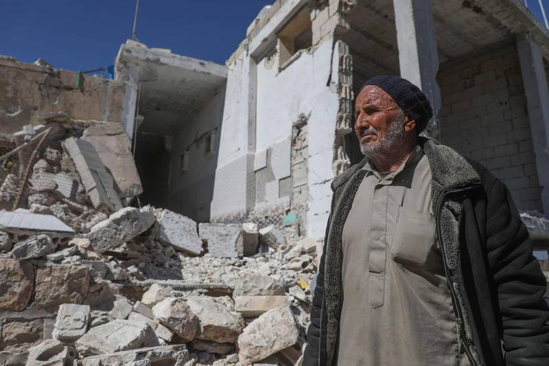 A Syrian man inspects the rubble of his destroyed house in the town of Ihsim in al-Zawiya Mountain region of Syria's northwestern Idlib province following a Russian-Turkish ceasefire deal.  AFP