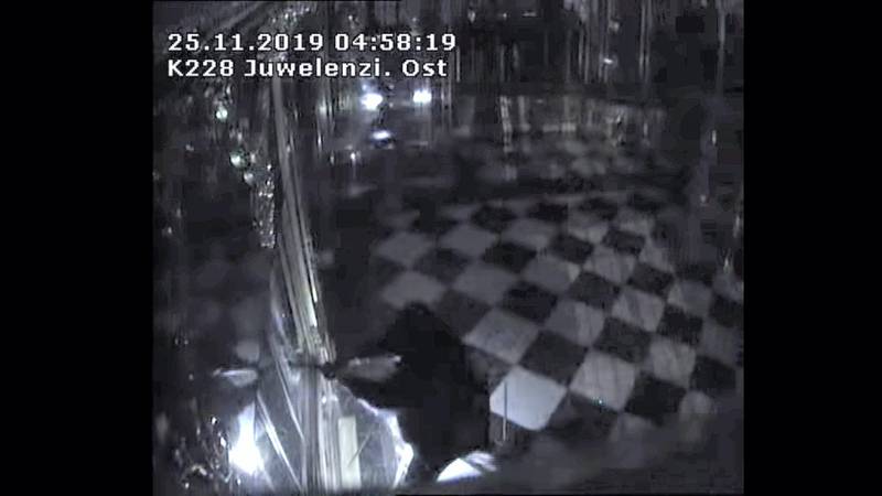 FILE PHOTO: Thieves with torches and tools break into one of the display cabinets in Green Vault museum in Dresden, Germany, November 25, 2019 in this still image taken from a security video. Saxony Police Department/Handout via REUTERS   THIS IMAGE HAS BEEN SUPPLIED BY A THIRD PARTY./File Photo